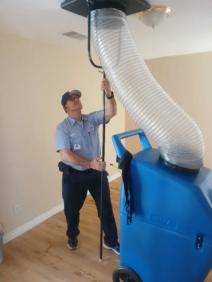 Furnace Tune-Up technician using HEPA equipment in Wilmington
